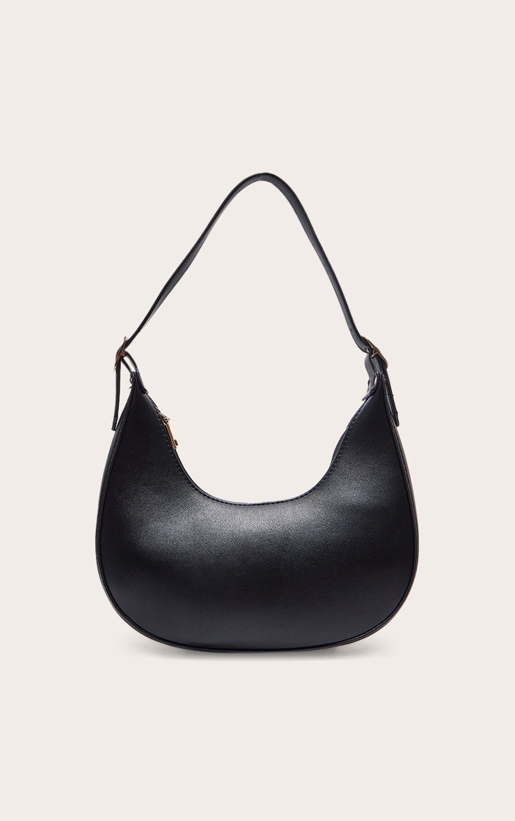 https://cdn-img.prettylittlething.com/5/0/0/0/5000367ce5a03780fc22b281ef70a11df3604055_CNA1617_1_black_curved_pu_shoulder_bag.jpg