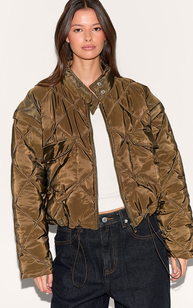 https://cdn-img.prettylittlething.com/5/a/b/2/5ab22f2df6bd58b1c9ed572e91eca93ac87d8dd5_CNL8602_1_khaki_cropped_quilted_jacket.jpg