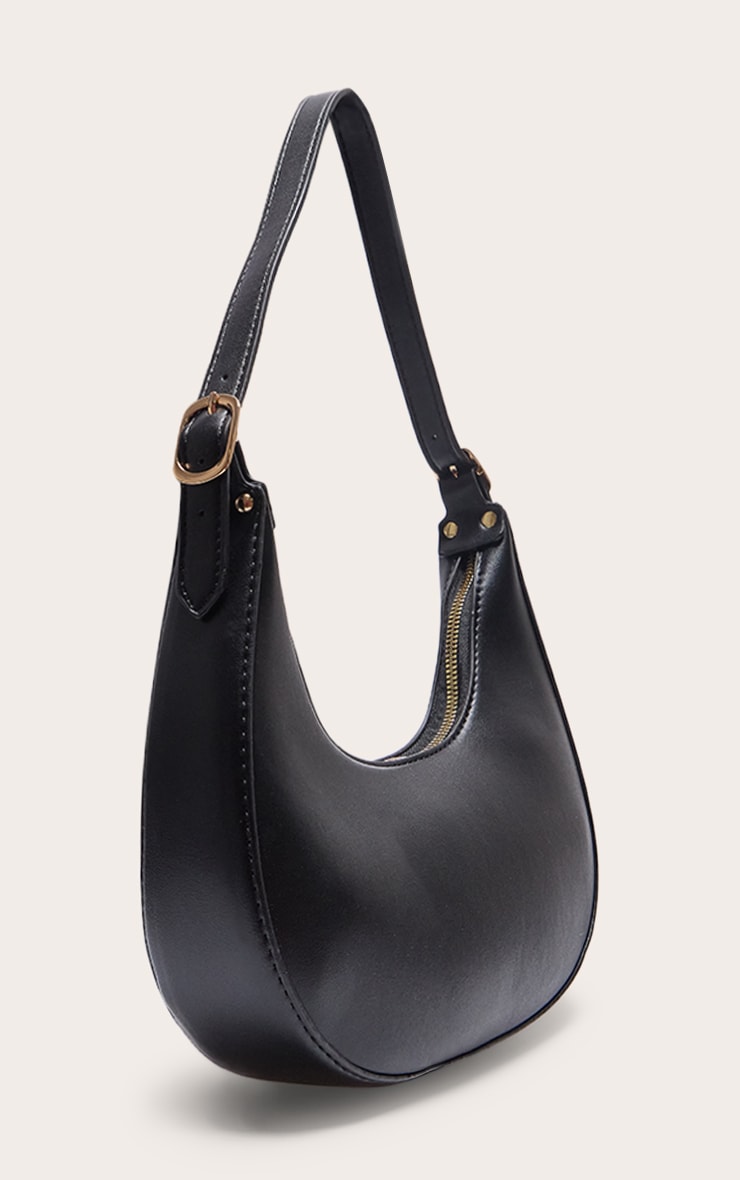 https://cdn-img.prettylittlething.com/9/f/d/5/9fd577a2aa6592f545eddf2f7fab8915154000ab_CNA1617_2_black_curved_pu_shoulder_bag.jpg