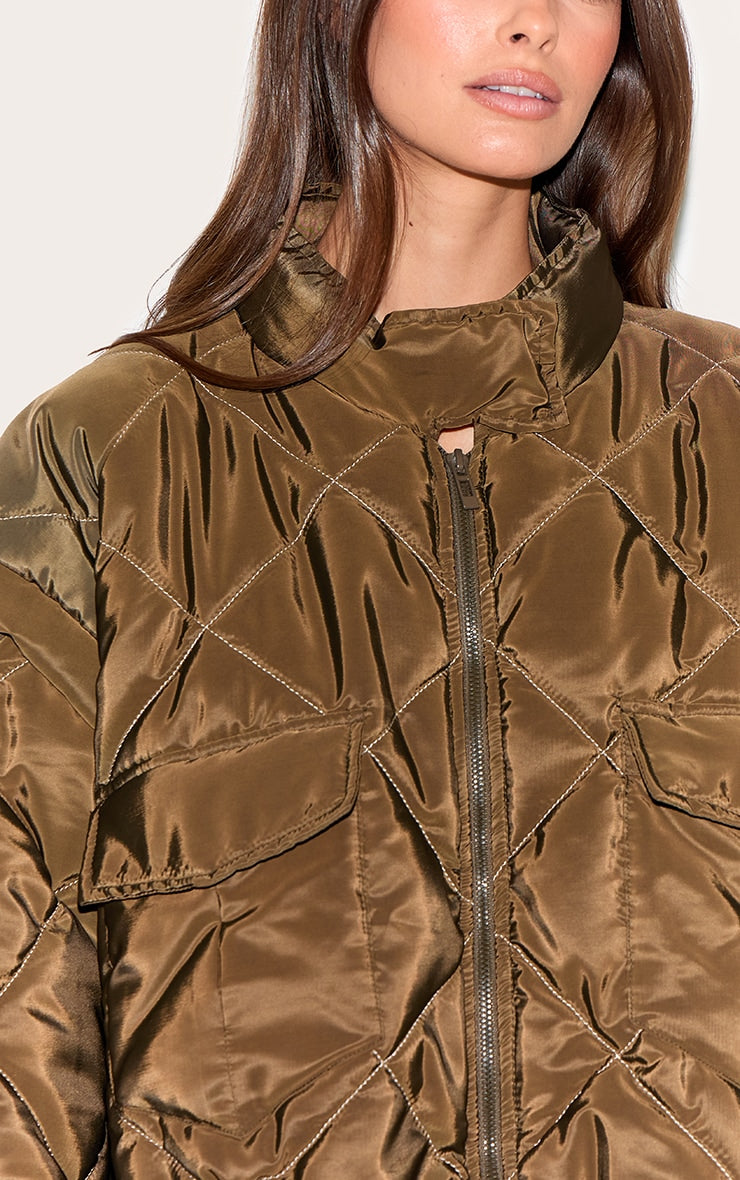 https://cdn-img.prettylittlething.com/e/f/a/d/efad1d49225cf47801cf8ef0a3781525bb84e262_CNL8602_4_khaki_cropped_quilted_jacket.jpg